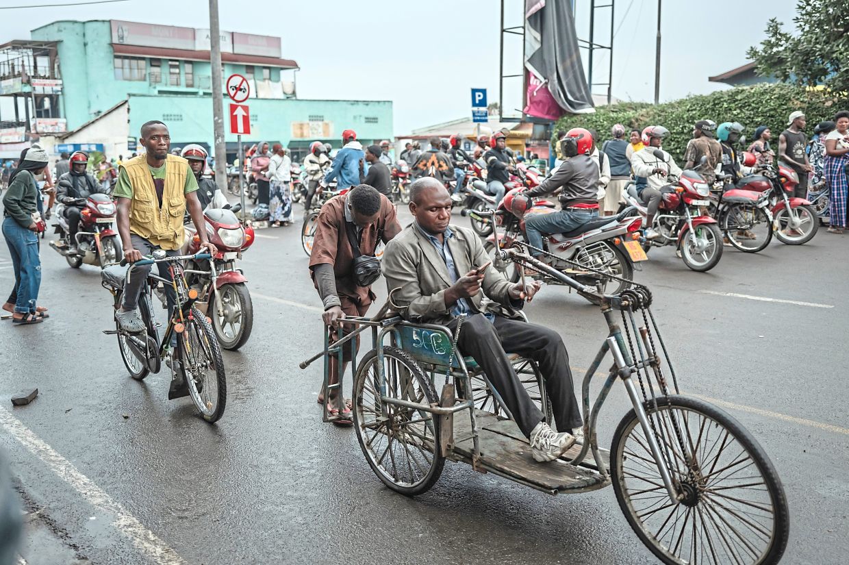 People moving through the busy border between Congo and Rwanda in the town of Gisenyi, Rwanda. — 2025 The New York Times Company.