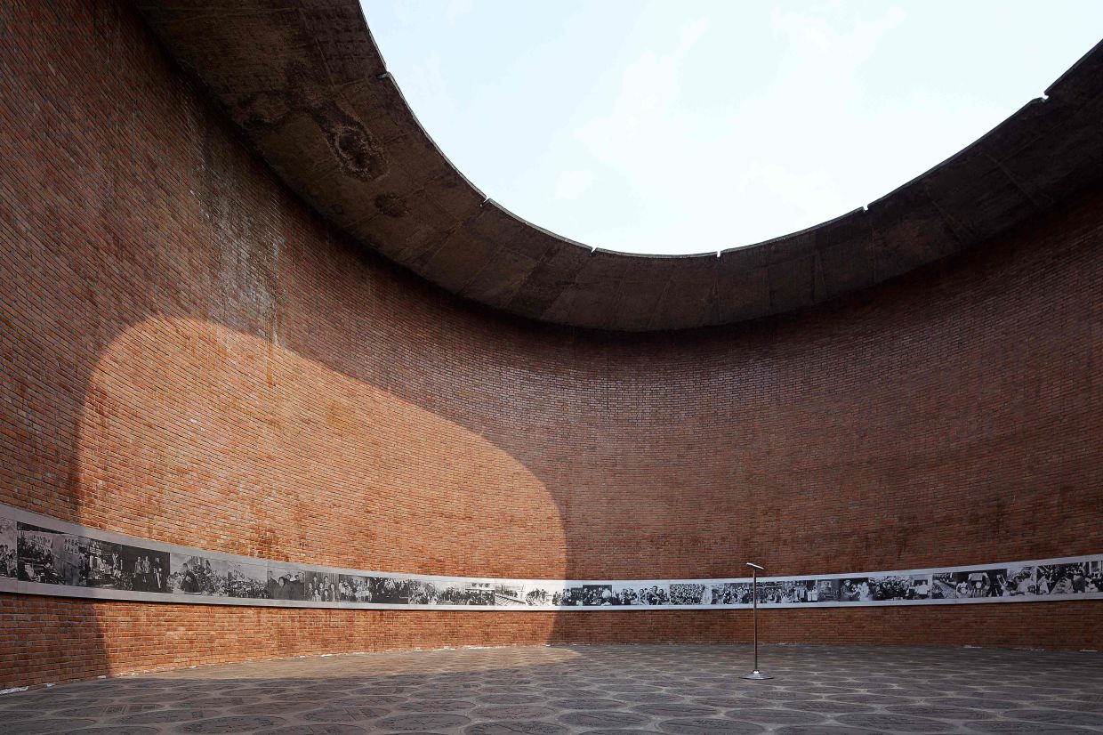 Liu's projects include the Museum of Clocks in Chengdu, a large circular structure with a skylight that illuminates an interior strip of photographs. Photo:Bi Kejian/The Hyatt Foundation/The Pritzker Architecture Prize/AFP