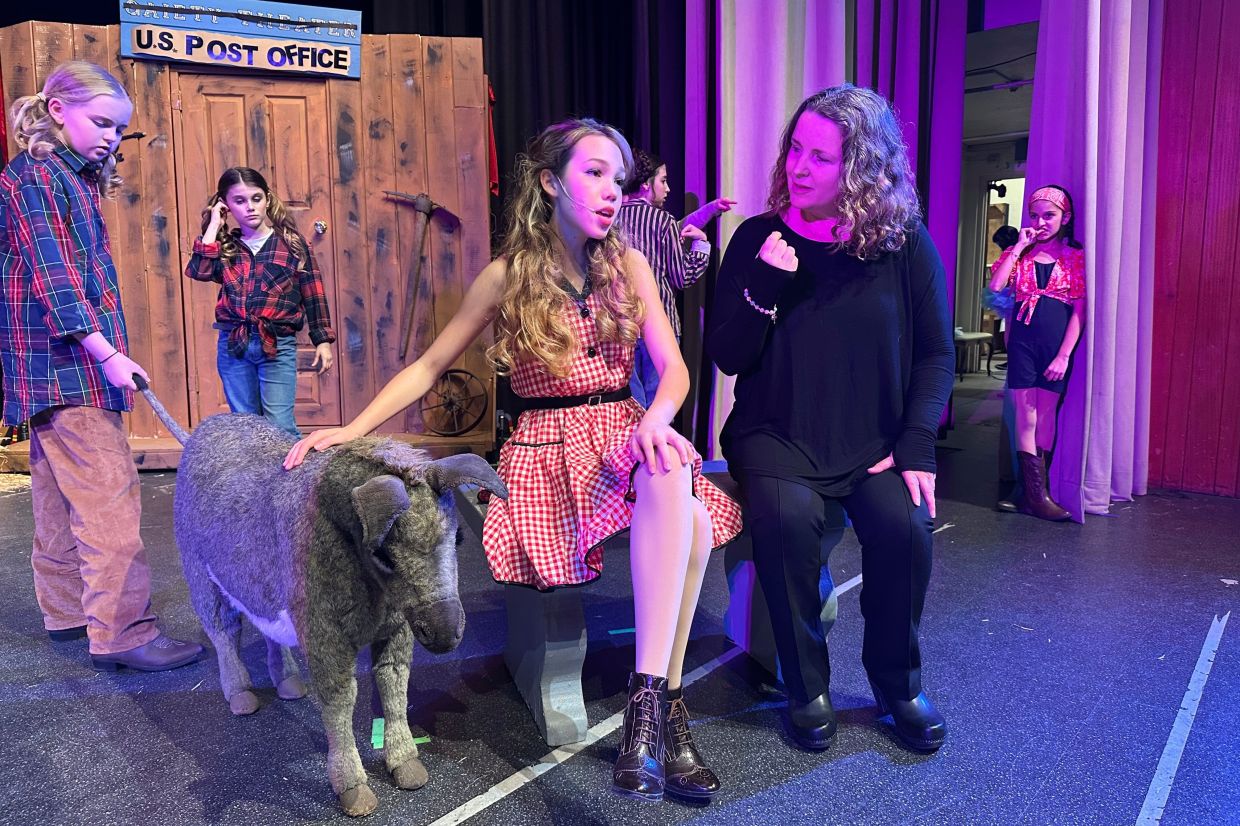 Lara Ganz, right, director of Theatre Palisades Youth, works on blocking with Anna Telehowski, 14, left, on opening night of the musical Crazy for You after the group lost their theater in the Palisades fire. — Photo: AP Photo/Jocelyn Gecker)