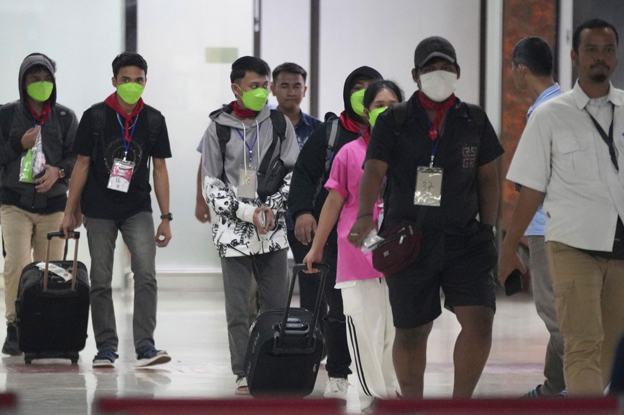Indonesians who were forced to work at scam centers in eastern Myanmar arrive at Soekarno-Hatta International Airport in Tangerang, Indonesia, Friday, Feb. 28, 2025.- AP Photo