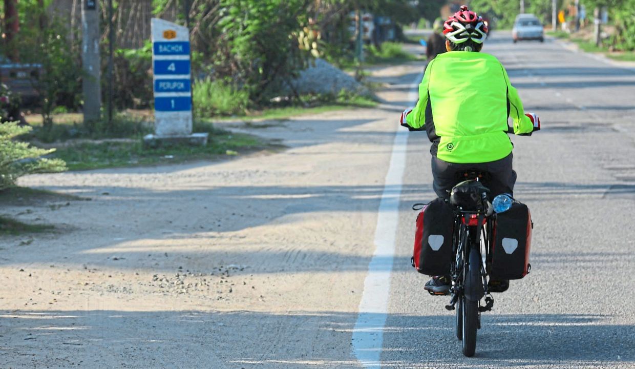 Traversing the East Coast of Peninsular Malaysia with a folding bike rigged to carry panniers.