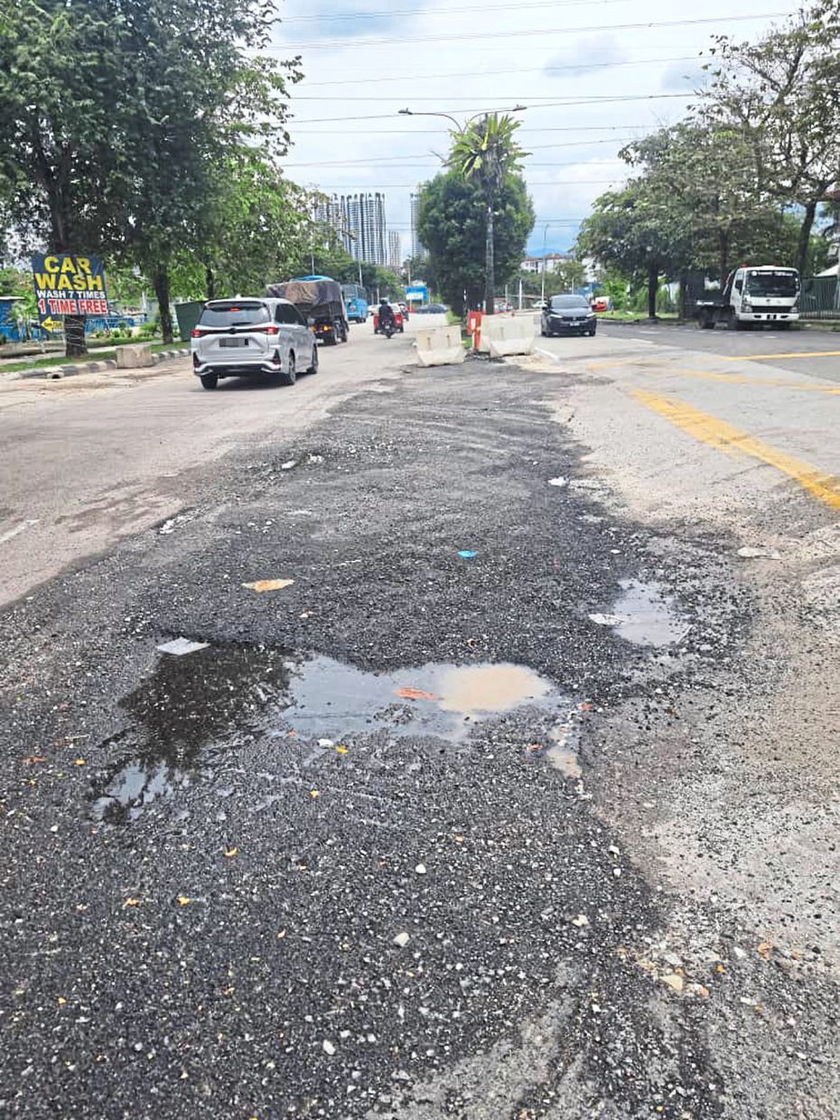 Kuala Lumpur roads are riddled with potholes. — Courtesy photo