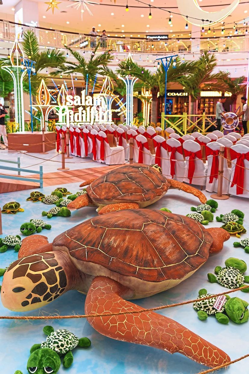 The vibrant floor decals feature turtles and hatchlings as a tribute to Terengganu.