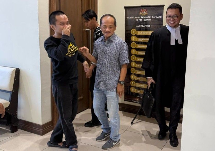 Mohd Fareez Izwan Mohd Idros breaks down in tears while embracing his family after being acquitted of a drug trafficking charge at the Kota Kinabalu High Court.
