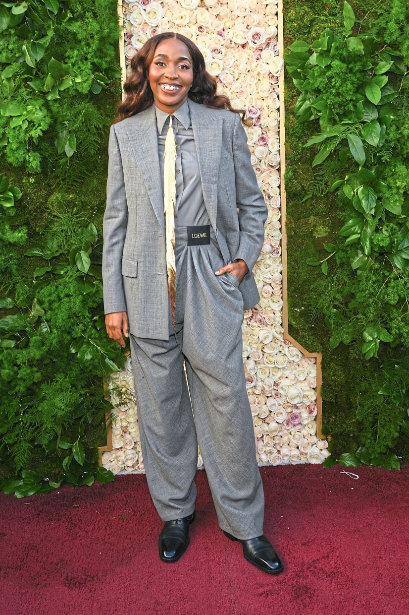Ayo Edebiri's custom grey wool tailored blazer, paired with a shirt, waistcoat and draped pants, is an overall powerful ensemble. Photo: Loewe