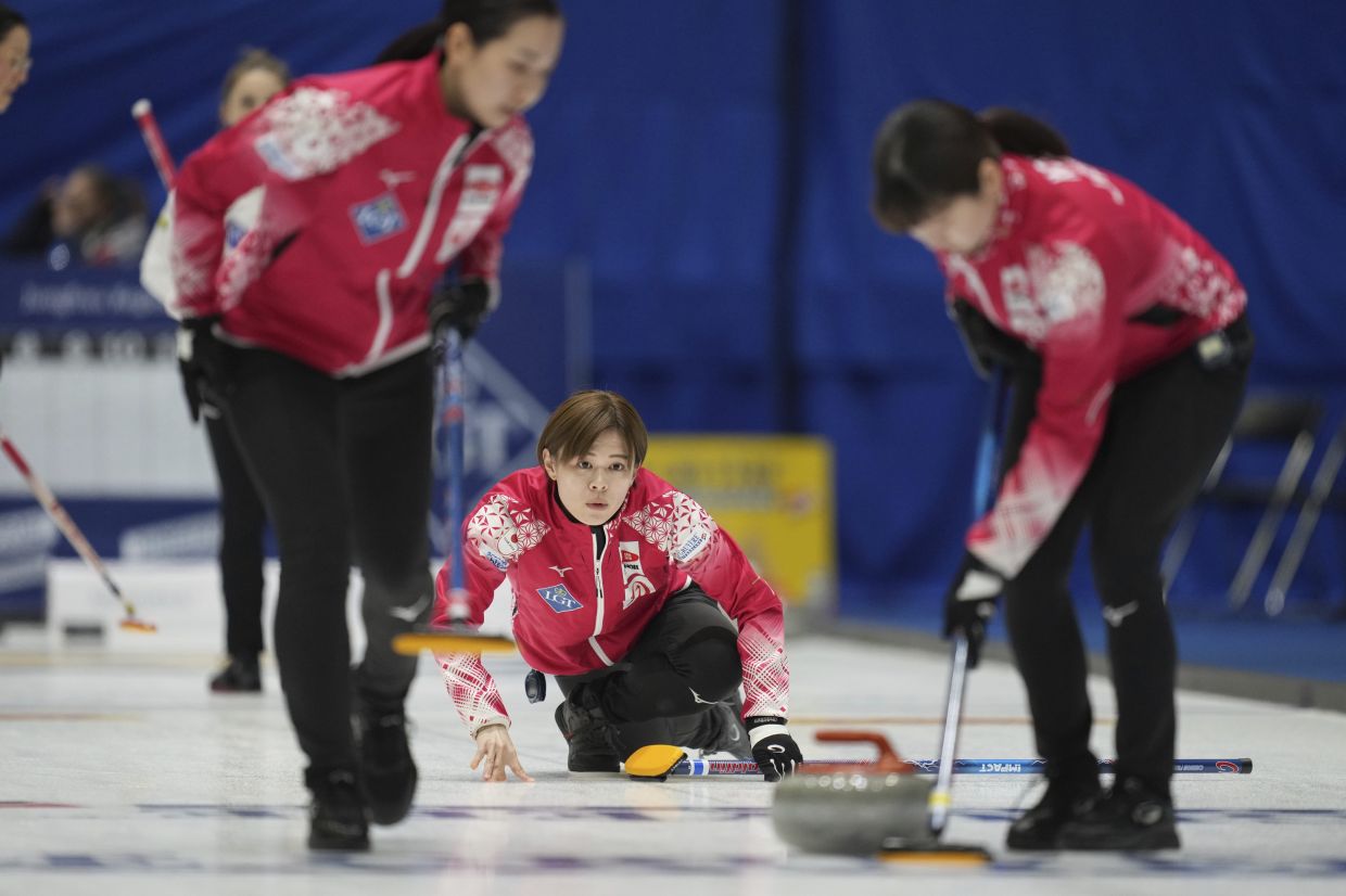 Japan's Kaho Onodera releases the stone during the match against Switzerland at the World Women's Curling Championship in Uijeongbu, South Korea, Monday, March 17, 2025. -- AP Photo/Lee Jin-man
