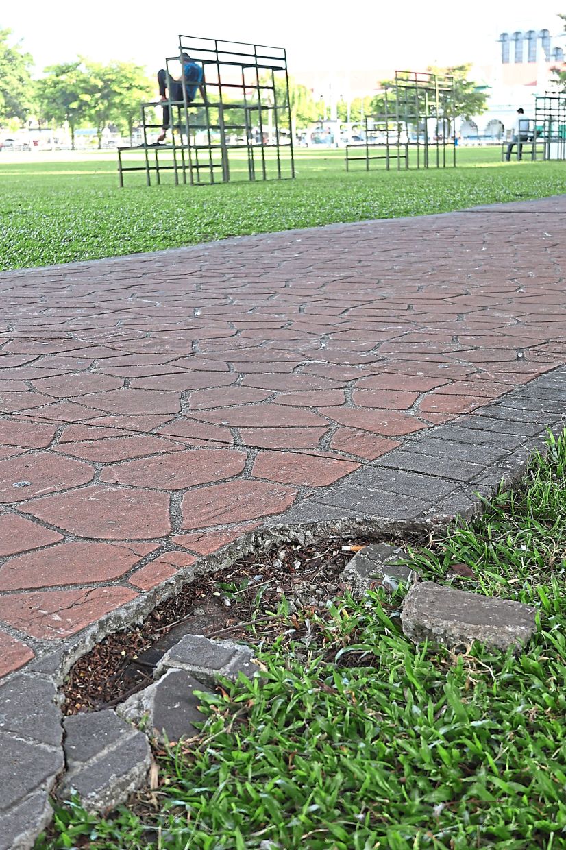 A broken path on Ipoh Padang’s joggers track posing a danger to park-goers.