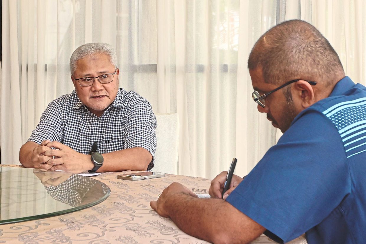 Mohd Noorazam, seen here with The Star news editor Nelson Benjamin, emphasises inter-agency efforts and pragmatism in achieving Irda’s goals.