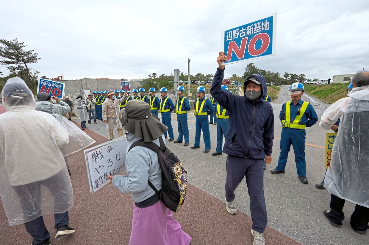 People protesting the construction of a US military base in Nago, Okinawa Island.
