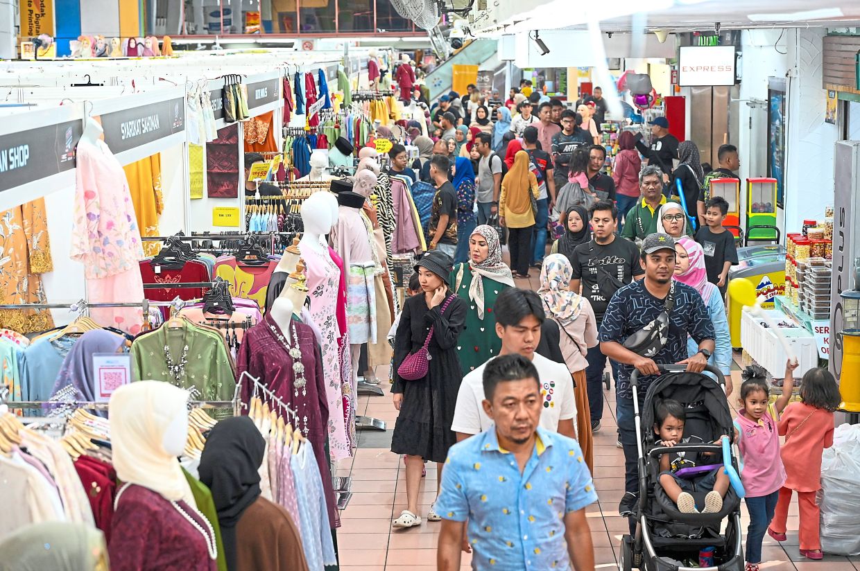 Shoppers navigating the busy corridors of PKNS Complex in Shah Alam.
