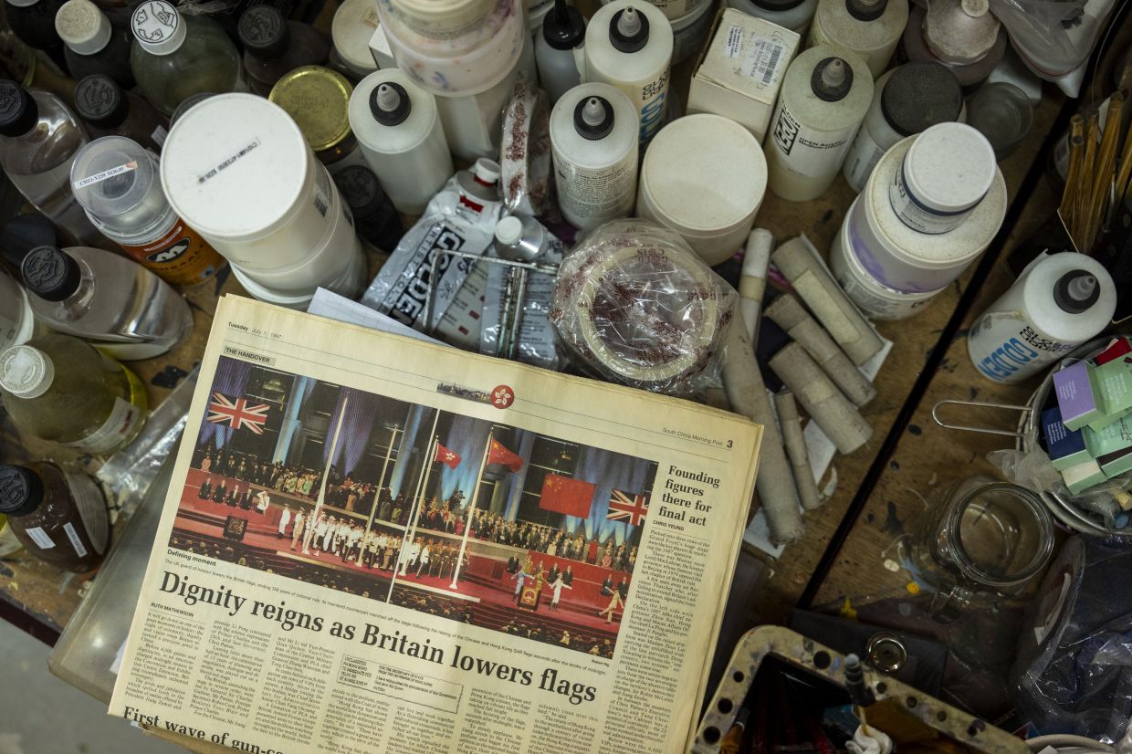 An old newspaper used as a reference for a painting sits in Chow's studio in Hong Kong. Photo: AP