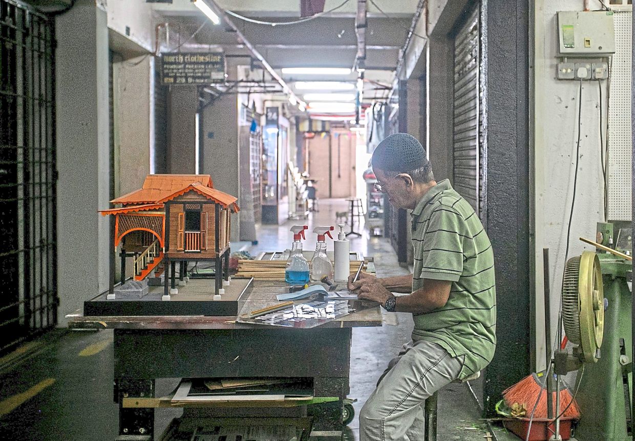 Saari hard at work producing a model house. 