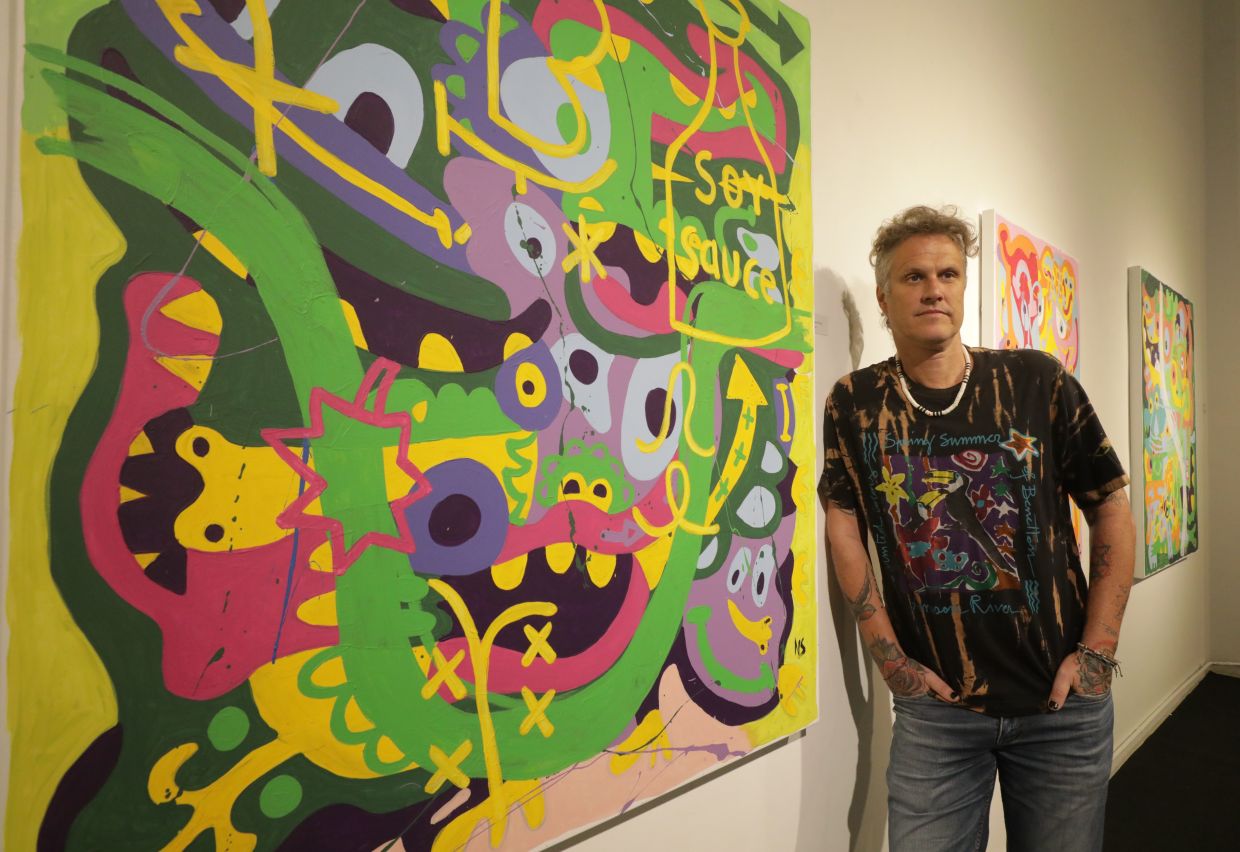Australian artist Nigel Sense posing with an artwork at the 'Rojak' exhibition at Zhan Art Space in Petaling Jaya. Photo: The Star/Samuel Ong 