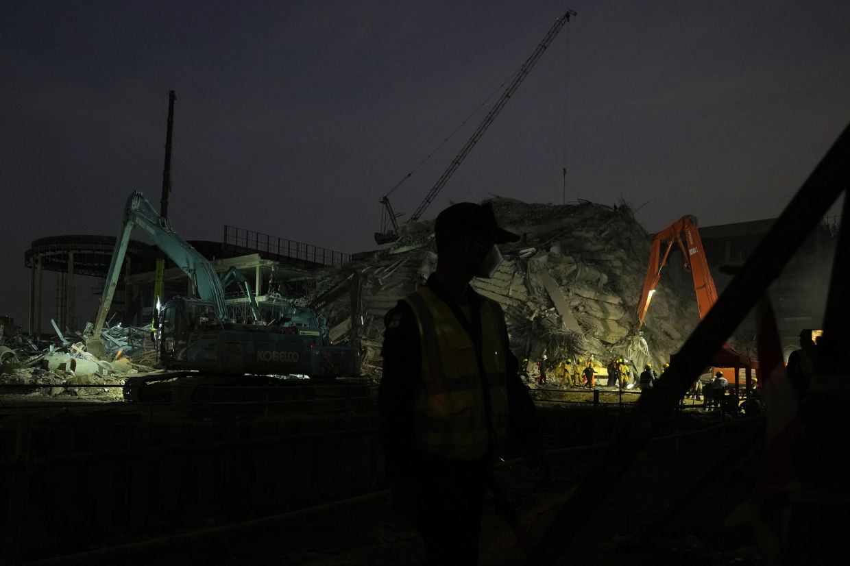 Rescuers work at the site of an under-construction high-rise building that collapsed on Friday after an earthquake in Bangkok, Thailand, Saturday, March 29, 2025. -- AP Photo/Manish Swarup