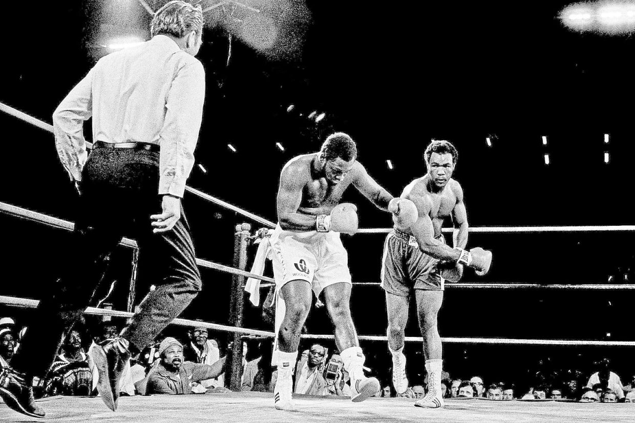 Joe Frazier is staggered by a hard right by Foreman in their heavyweight title fight in Kingston, Jamaica, on Jan 23, 1973. — AP
