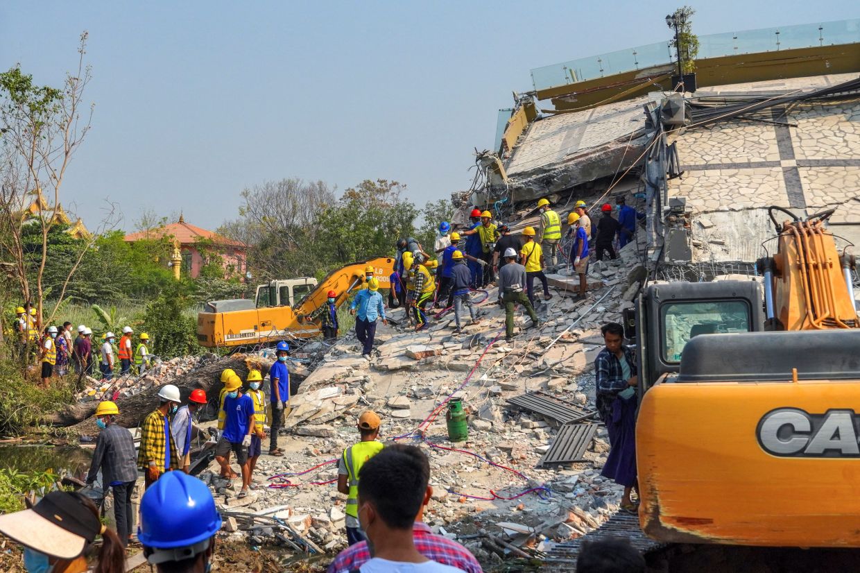 Rescue workers continuing a search operation at the site of a collapsed building, in the aftermath of a strong earthquake, in Mandalay, Myanmar, on March 31, 2025. - Reuters