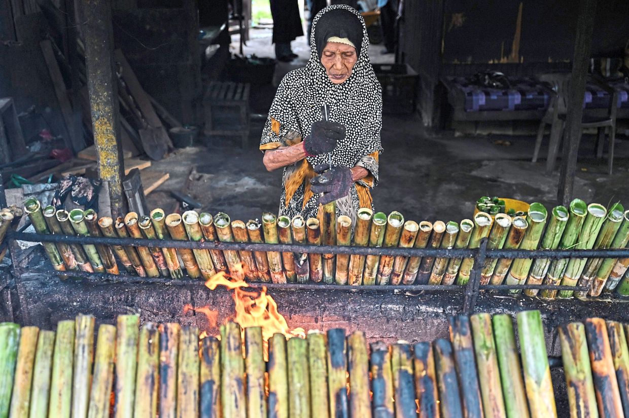 A trader at the Kijal night market in Kemaman, Terengganu, selling up to 1,000 sticks two or three days before Hari Raya.