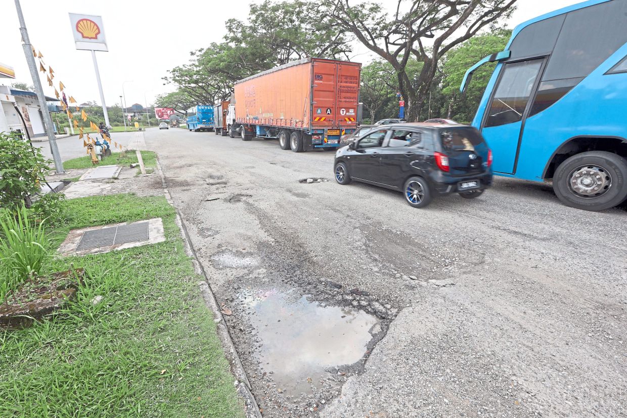 Potholes spotted on Jalan Impian Emas Utama in Skudai.
