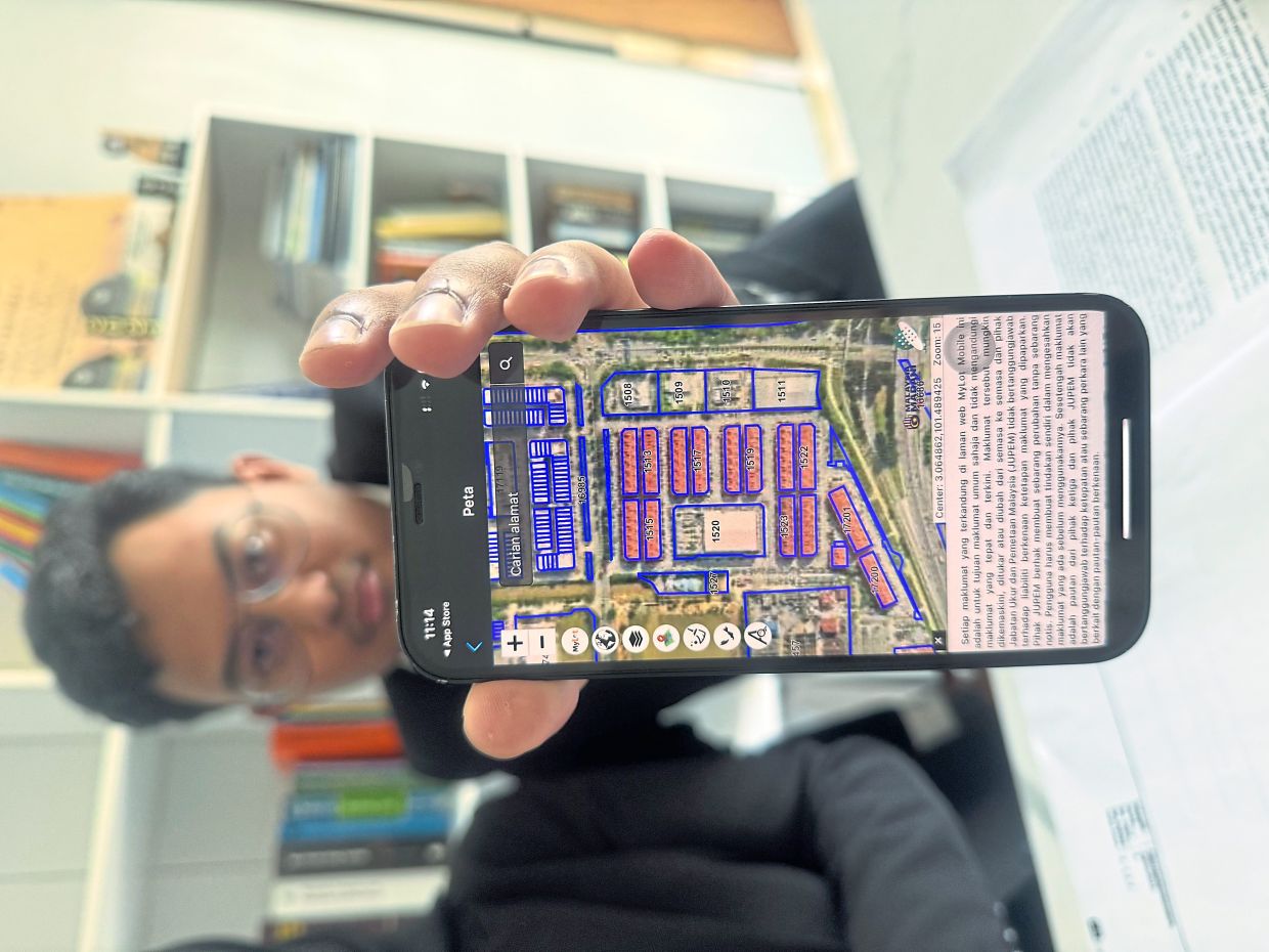 Wafiyuddin showing an example of how plot numbers of a property can be obtained on the Survey and Mapping Department app by entering an address. The plot numbers documentation will reveal if the property is leasehold or freehold.