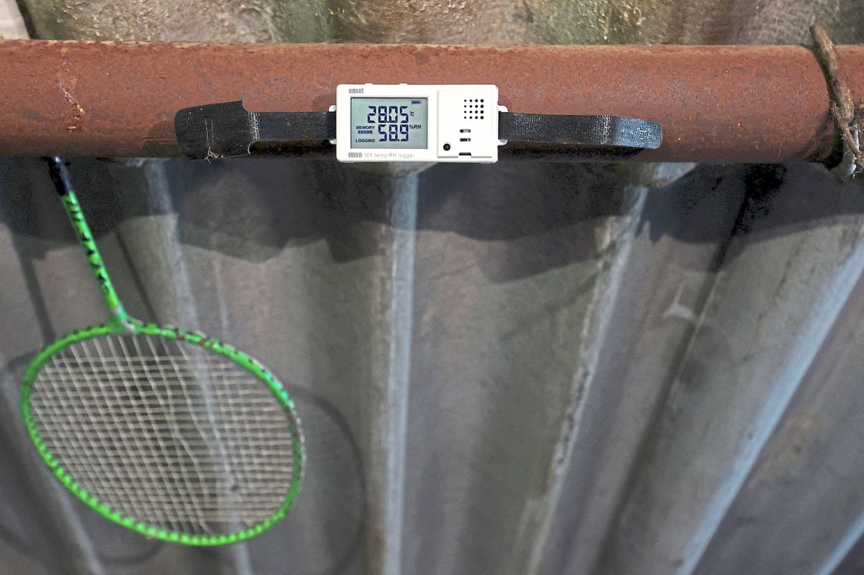 A data logger on a house roof that records and transmits temperature and relative humidity after the white coating is applied. — Reuters 