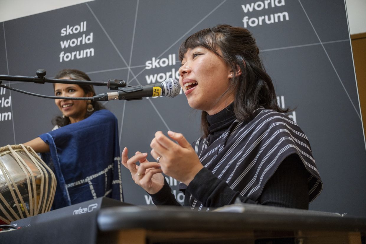 Rara Sekar, who goes by hara, performs during a session at the Skoll World Forum in Oxford, England. -- AP Photo/Vickram Sombu