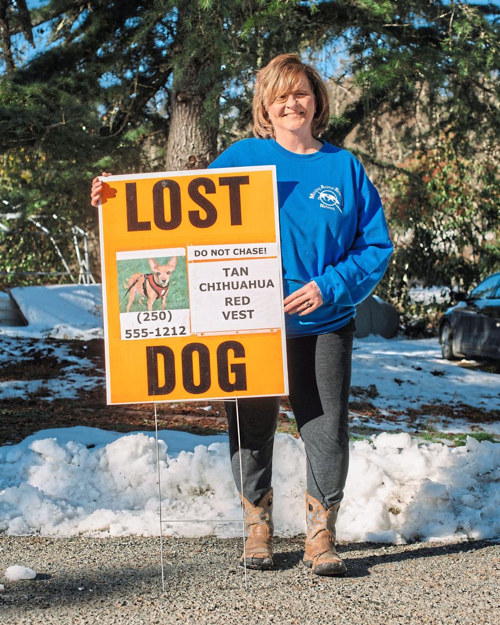 Albrecht, a lost-pet detective, with a typical poster she places in high-traffic areas when pets are missing. Recovering missing animals requires understanding both animal and human behaviour.