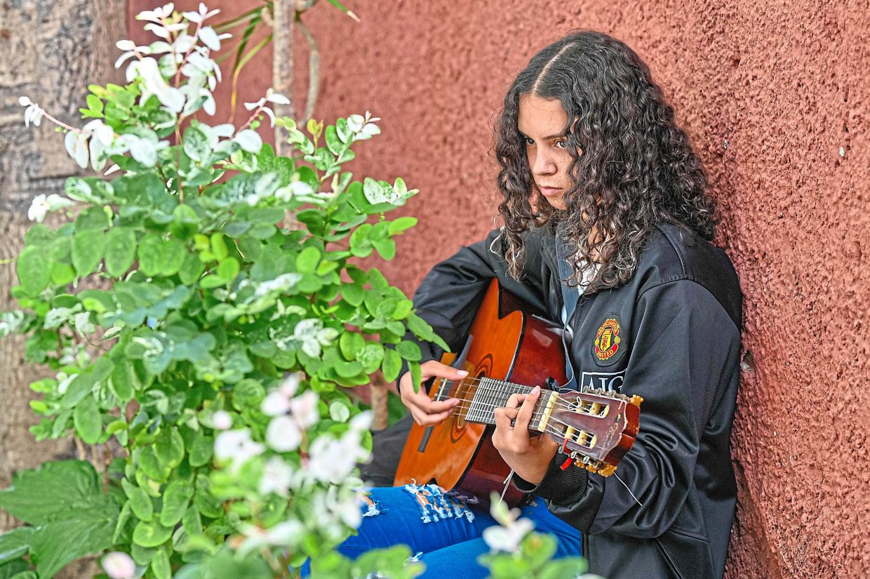 A member of the group performs during a rehearsal.