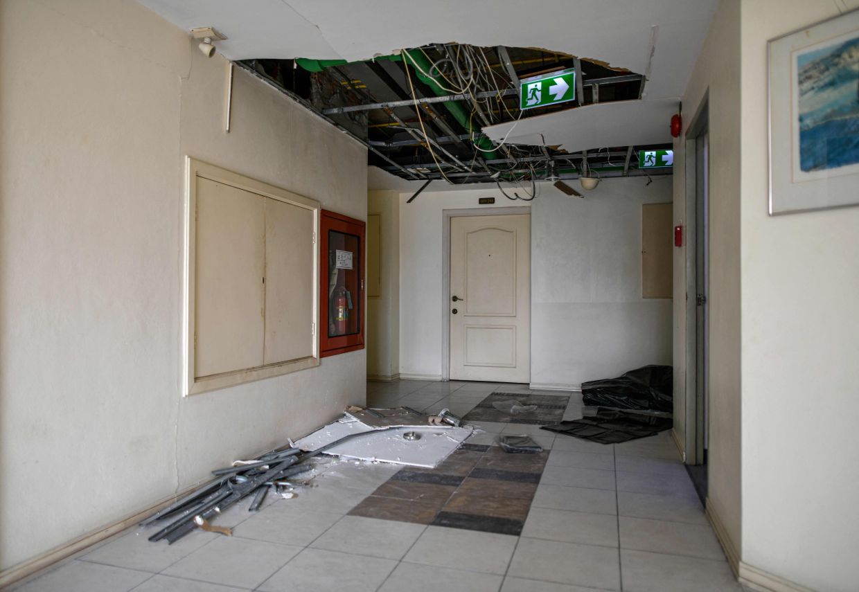 A damaged corridor inside a high-rise residential condominium in Bangkok following the March 28 earthquake that struck central Myanmar and Thailand. - AFP