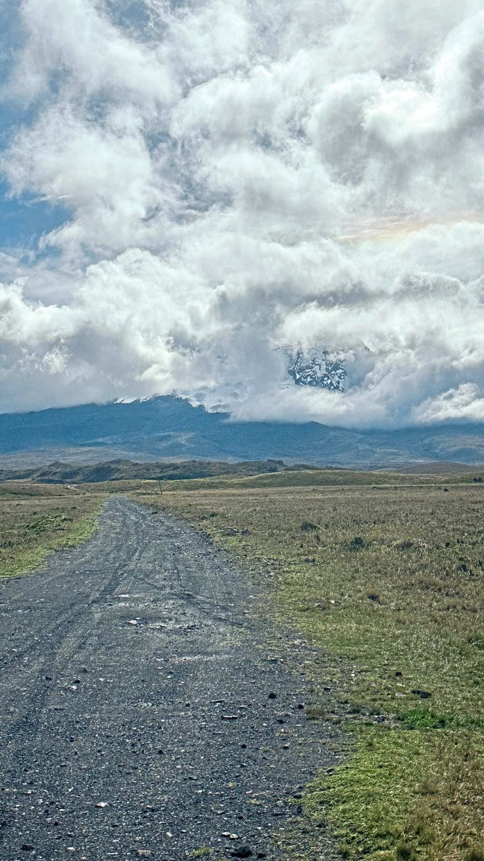 Snow-capped antisana, an active stratovolcano rising 5,753m in Ecuador’s Eastern Cordillera, pierces through drifting clouds in a majestic display of Andean power and beauty.