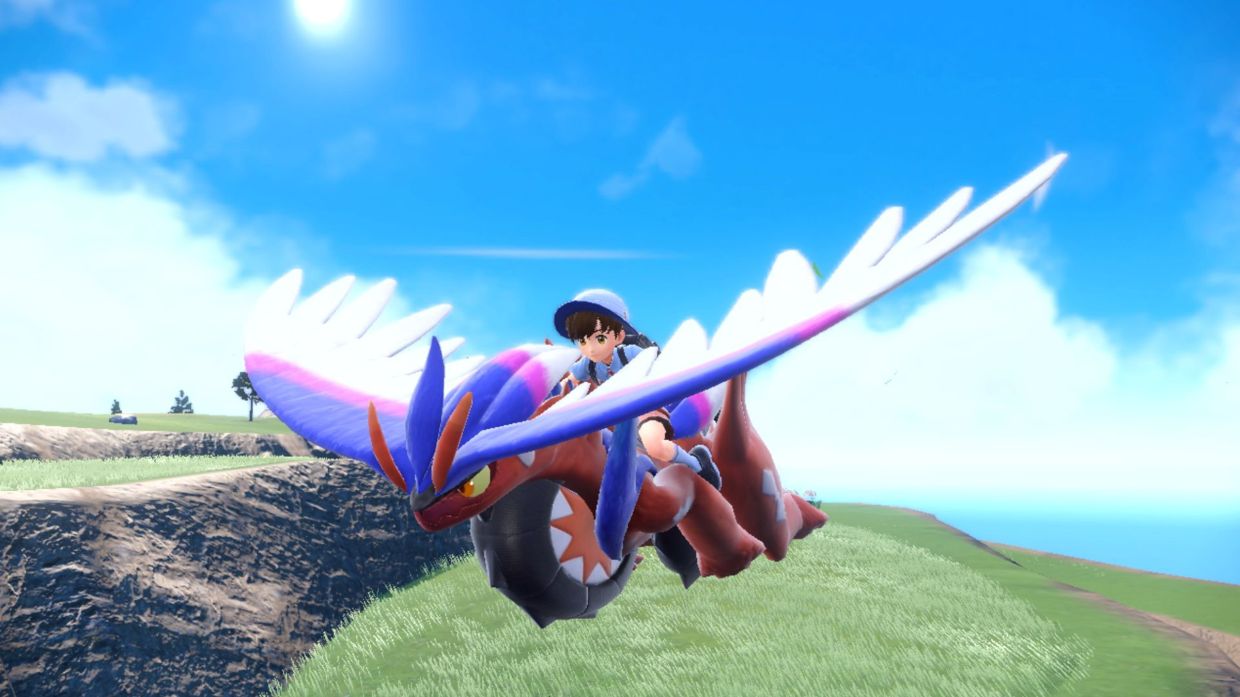 Koraidon glides through the air in 'Pokemon Scarlet.' Although players can't immediately uses the legendary Pokemon in battles, it proves essential when it comes to exploring Paldea.
