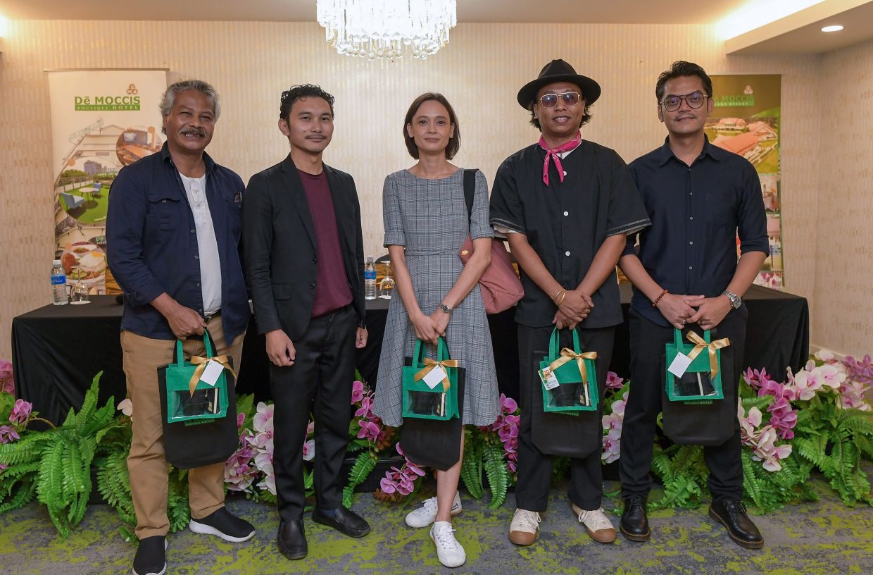 'Keluang Man' playwright and director Walid Ali (second, left) pictured with the main cast: Han Zalini as Keluang Man/Borhan (second right), Christina Suzanne as Suri (centre), Jay Iswazir as Samsir (right), and Azman Hassan as Cikgu Ahmad (left). Photo: Bernama