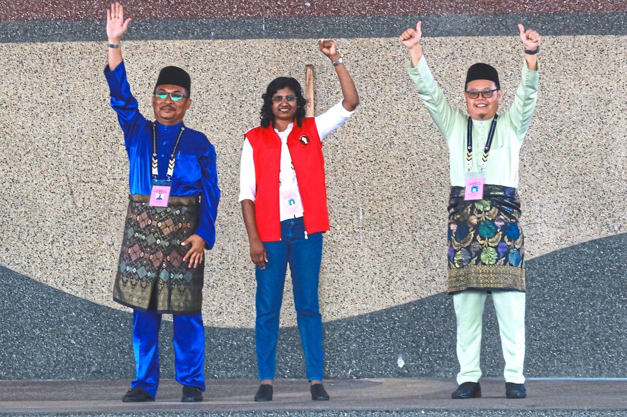 In high spirits: (From left) Mohamad Yusri, Bawani and Abd Muhaimin. — RONNIE CHIN/The Star