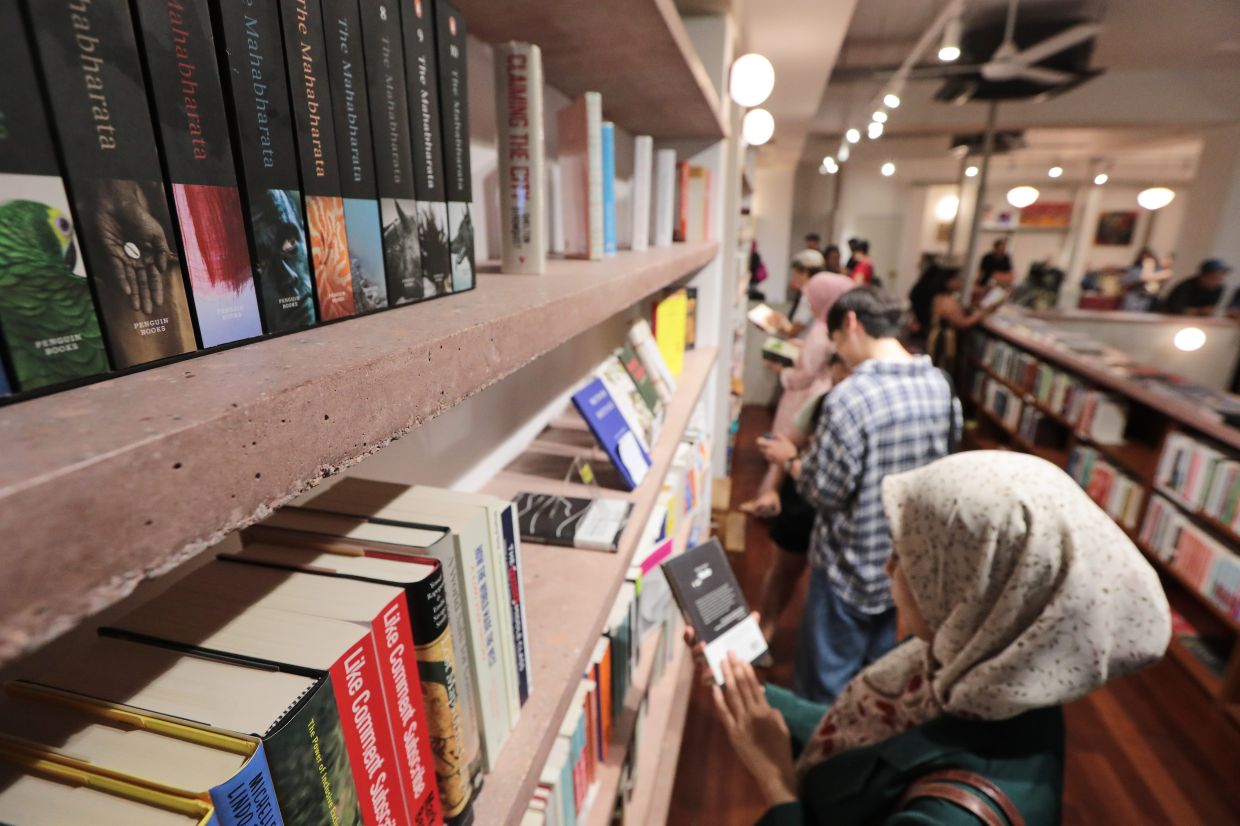 Customers browsing titles at Tintabudi bookshop in Kuala Lumpur, known for its curated selection of philosophy, literary fiction, politics and independent publications. Photo: The Star/Yap Chee Hong
