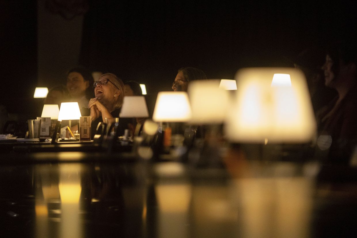 Audience members laugh during Stand Up For Climate, a comedy show at Flappers Comedy in Burbank, California. Photo: AP