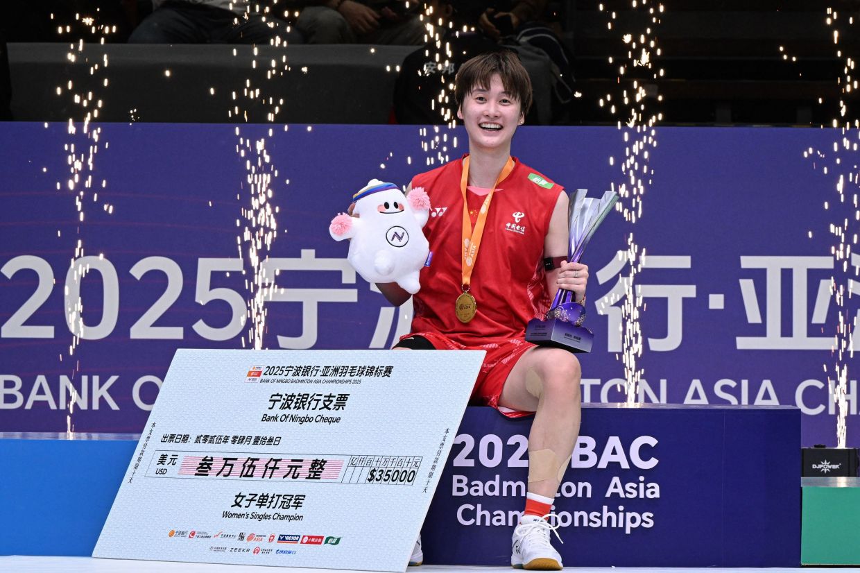 Gold medalist China's Chen Yufei celebrates on the podium during the award ceremony for the women's singles final match at the Badminton Asia Championships in Ningbo, in China's eastern Zhejiang Province on Sunday, April 13, 2025. -- Photo by AFP
