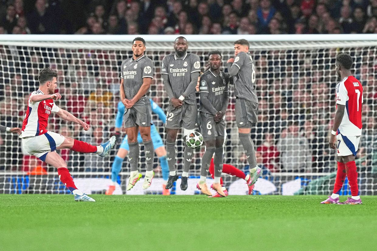 Arsenal’s Declan Rice (left) scores his side’s opening goal. — AP