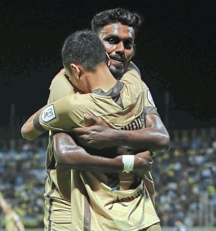 Solid strike: Pahang’s T. Saravanan celebrating with Baqiuddin Shamsuddin after scoring against Perak. — Pahang FC