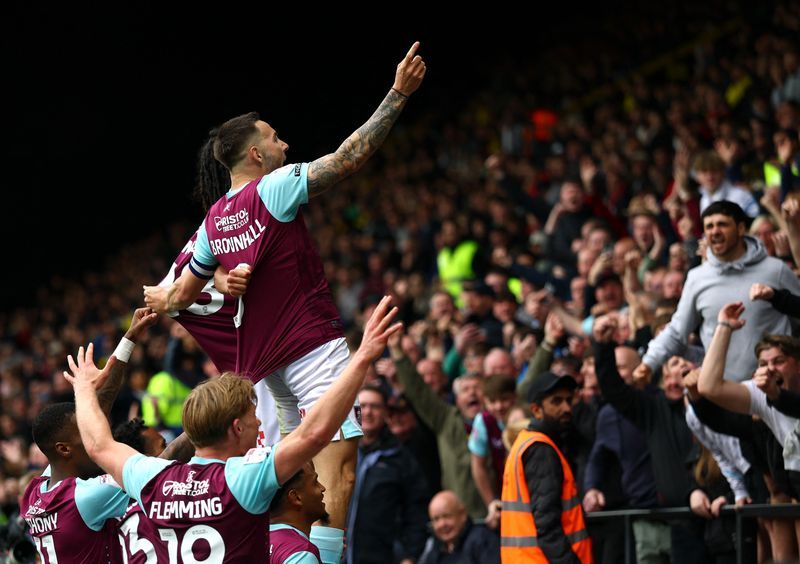 Soccer-Burnley edge closer to Premier League promotion with win over Watford