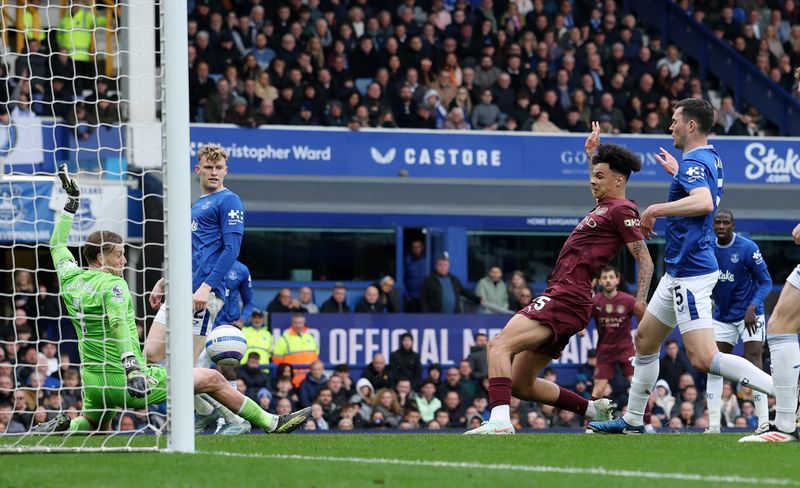 Soccer-Manchester City strike late in 2-0 victory at Everton