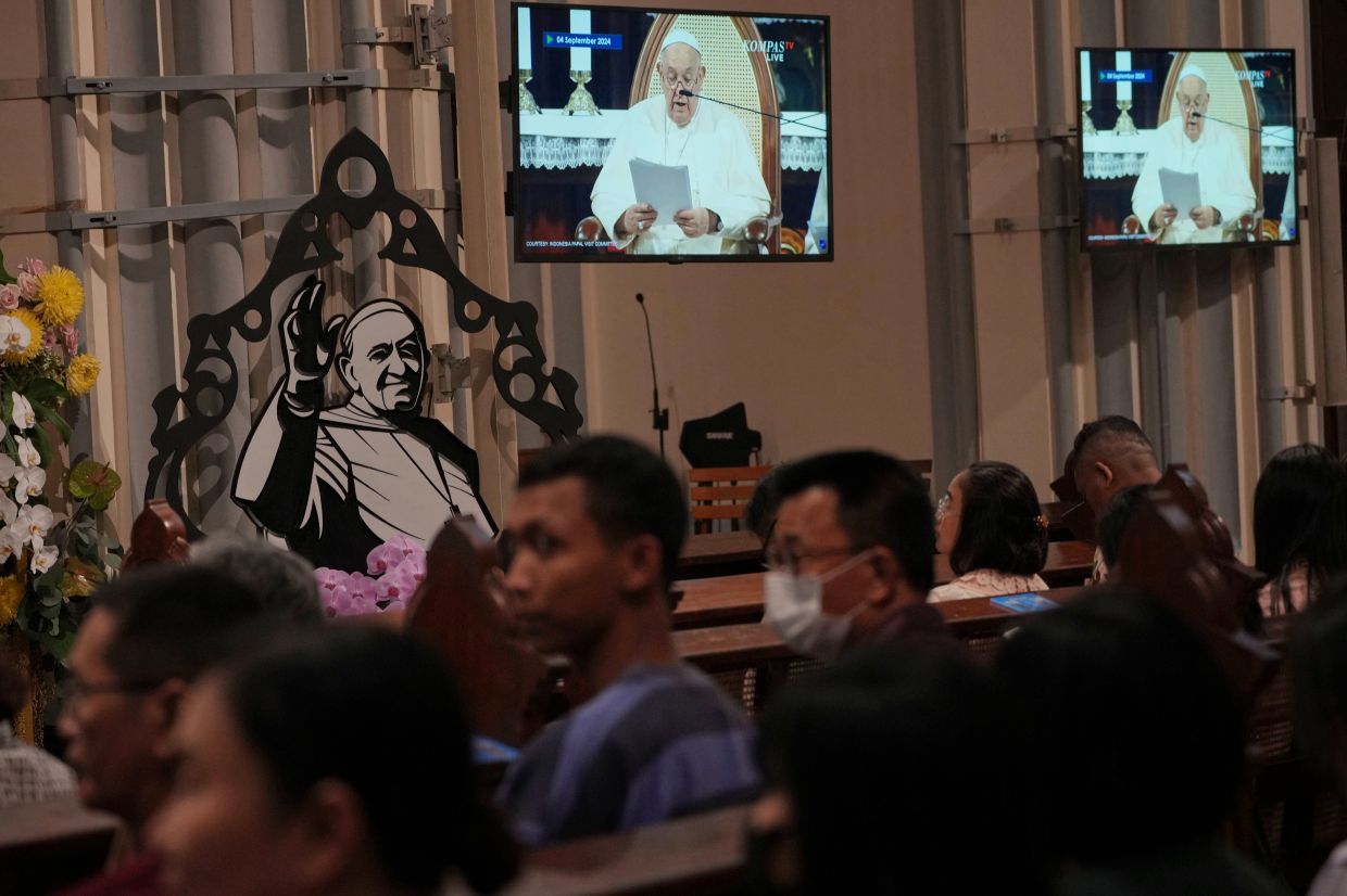 Worshippers attend a mass at the Church of Our Lady of the Assumption which was visited by Pope Francis in 2024, in Jakarta, Indonesia, Monday, April 21, 2025. -- AP Photo/Achmad Ibrahim