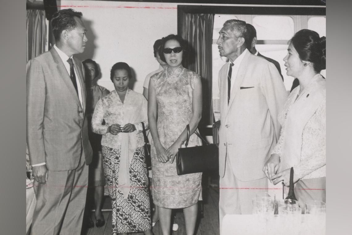 Then Prime Minister Lee Kuan Yew and Mrs Lee chatting with Yusuf Ishak and Noor Aishah (far right) on board the Australasia on March 5, 1968. - ST FILE