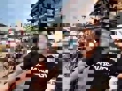 QuickCheck: Is a shop owner throwing T-shirts into the Melaka River?