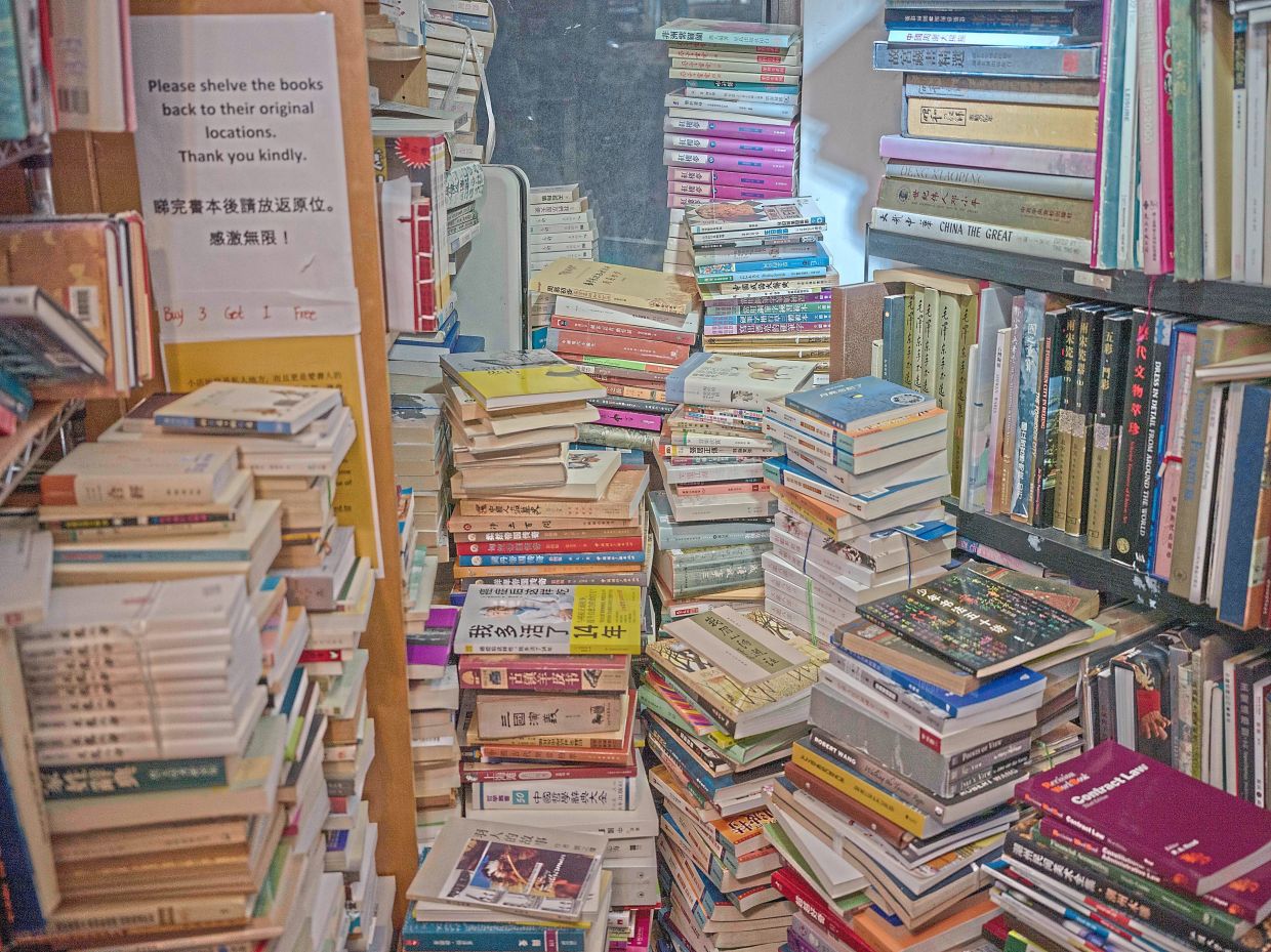 The collection at Lily Bookshop is largely made up of donated books. Photo: The New York Times/Lam Yik Fei