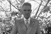 British singer Robbie Williams says being approached by fans for selfies makes him feel uncomfortable and can trigger panic