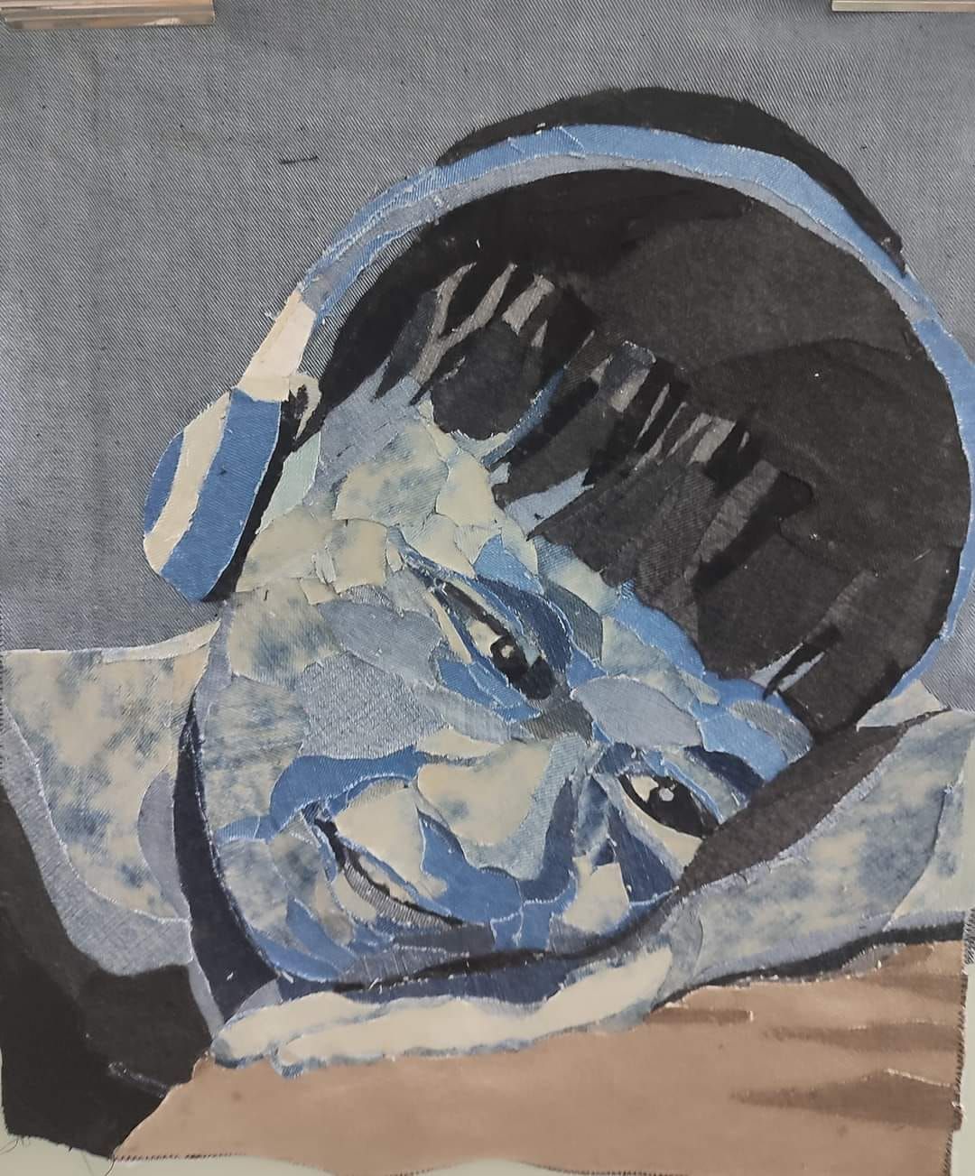 A portrait created by Khalidah using threads and fabrics.
