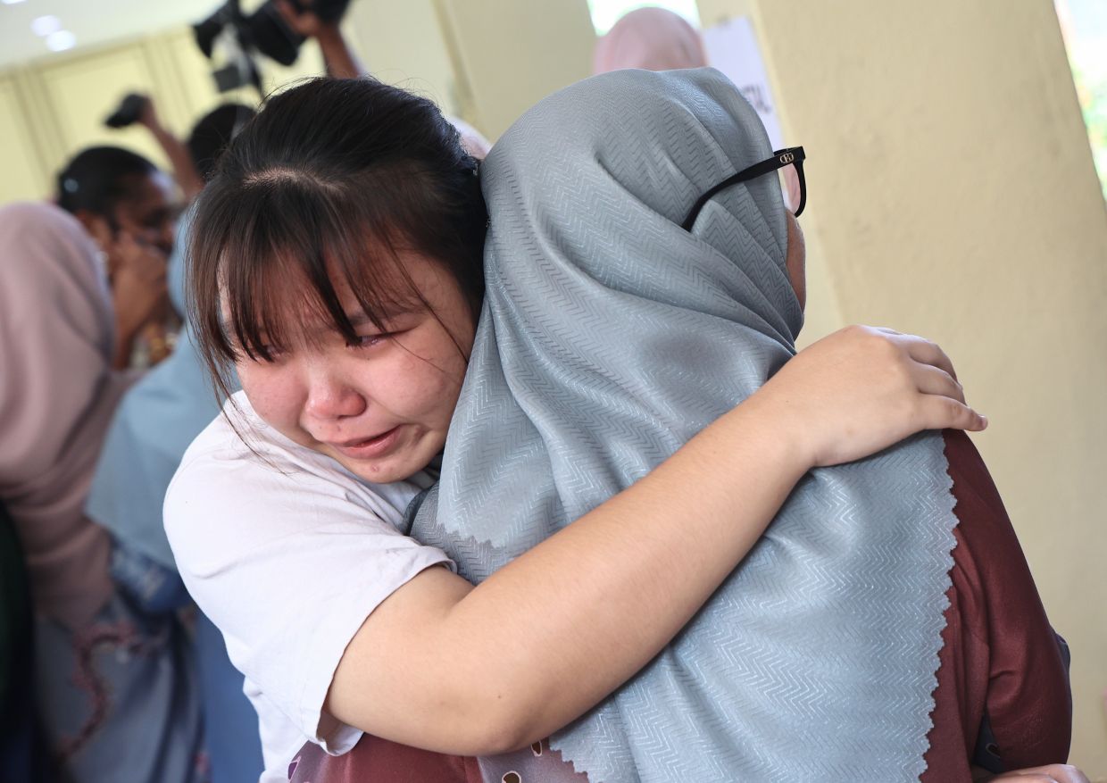 A student shedding tears of joy after receiving her SPM result  at SMK Convent Kajang, Selangor. — AZMAN GHANI/The Star