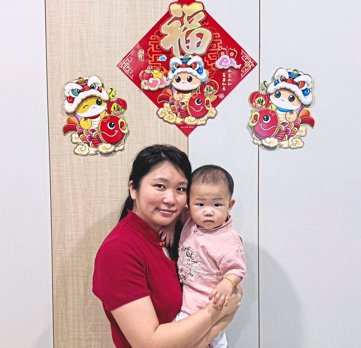 Ong with her second bundle of joy, who just turned one earlier this month. — ONG HUI ER