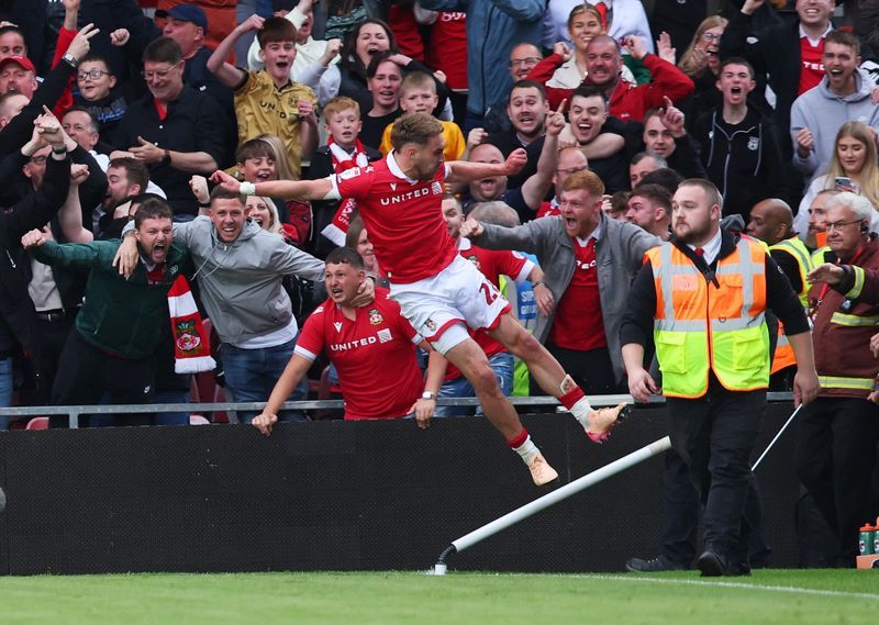 Soccer-Wrexham's story-book rise continues with record third straight promotion