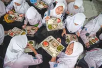 Indonesian free meal programme faces hurdles on food safety, funds management