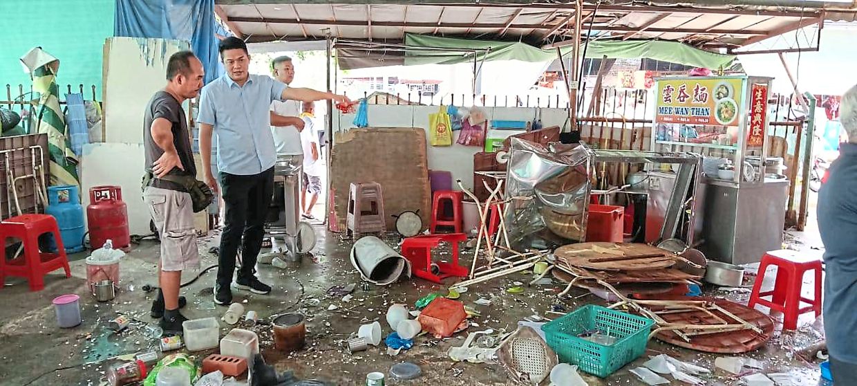 Deadly collision: The coffee shop in Sungai Petani, Kedah, is wrecked after the car crashed into it, killing a saleswoman. — Social media pic